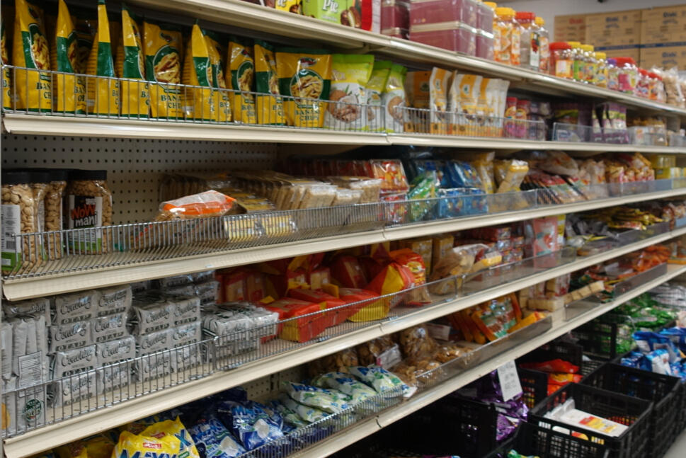 Store aisle with different Asian snacks like chips, candy, biscuits, etc.