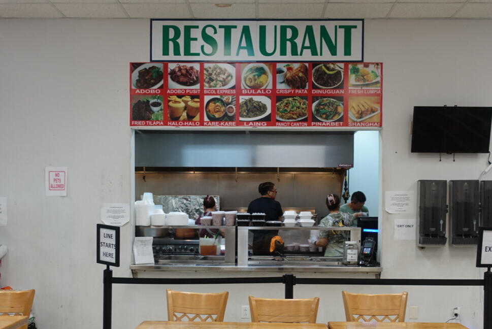Filipino Restaurant inside the store, with tables and chairs where you can enjoy your food.